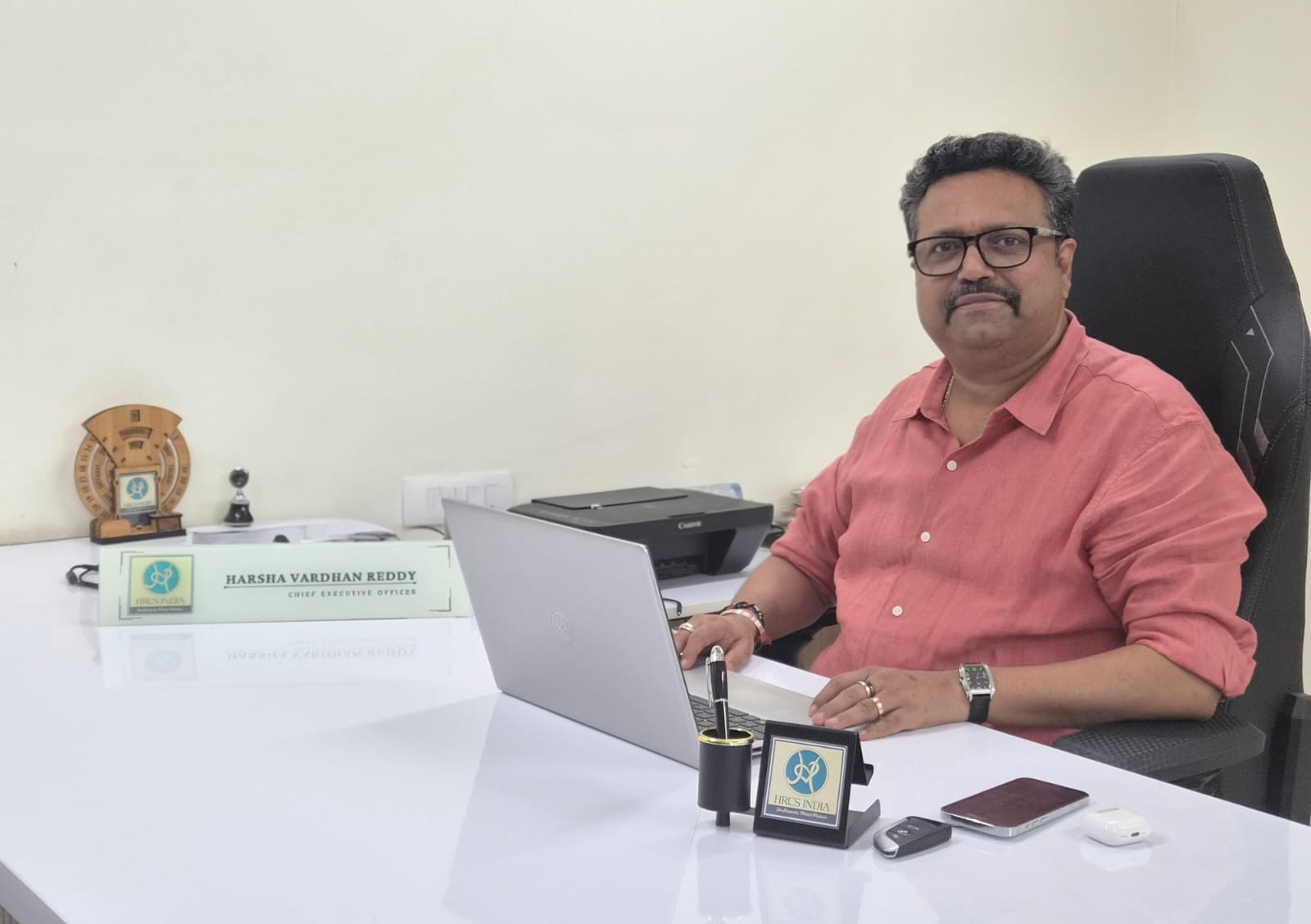D. Harshavardhan Reddy, Founder & CEO of HRCS India, at his office desk